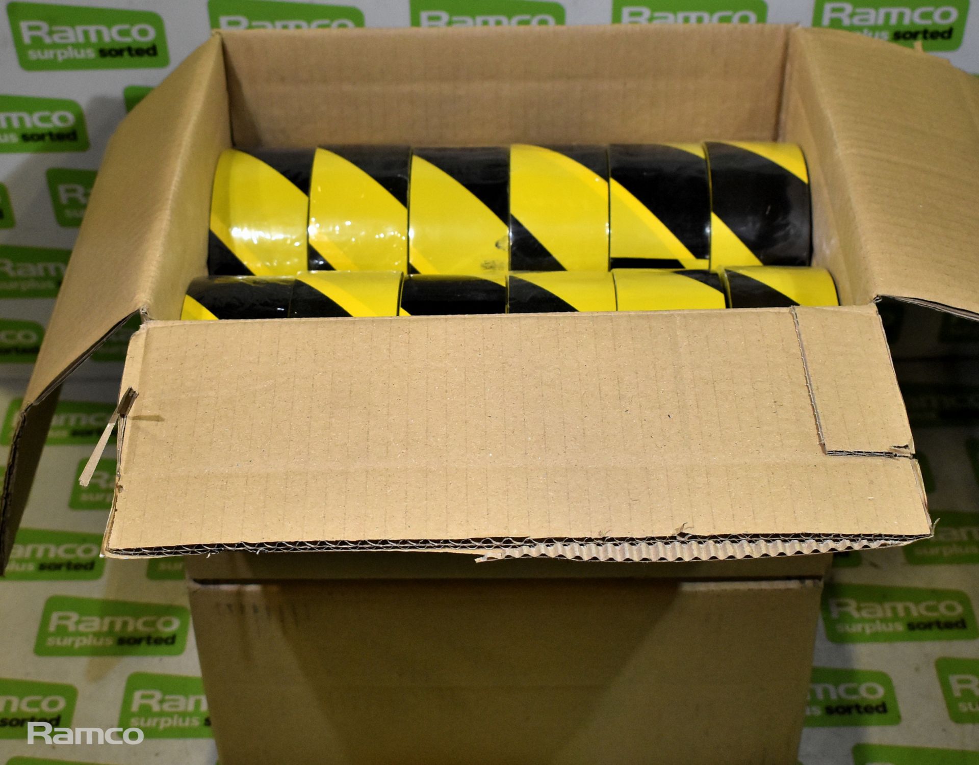 2x boxes of Black and yellow hazard tape - 12 rolls per box