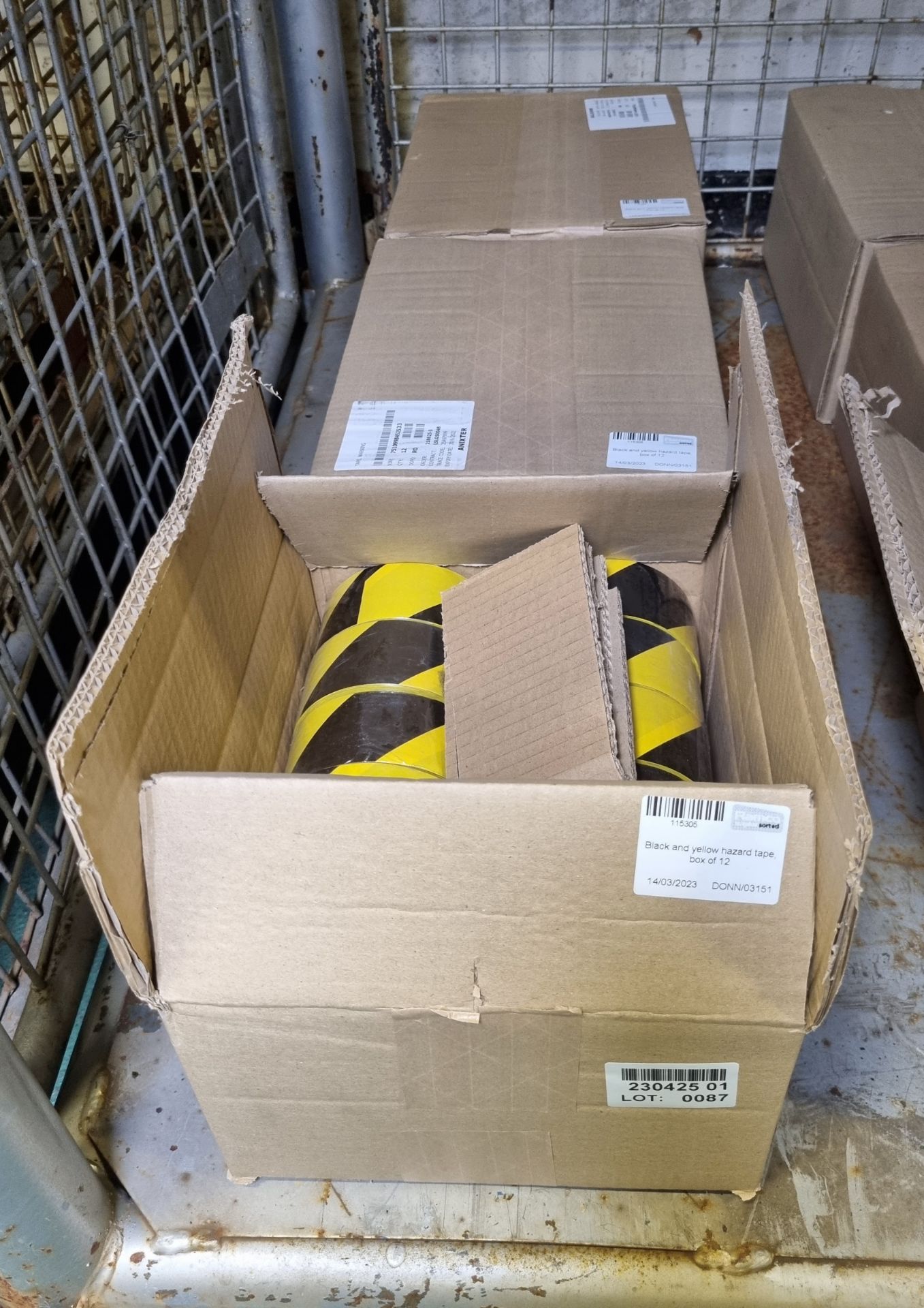 3x boxes of Black and yellow hazard tape - 12 rolls per box