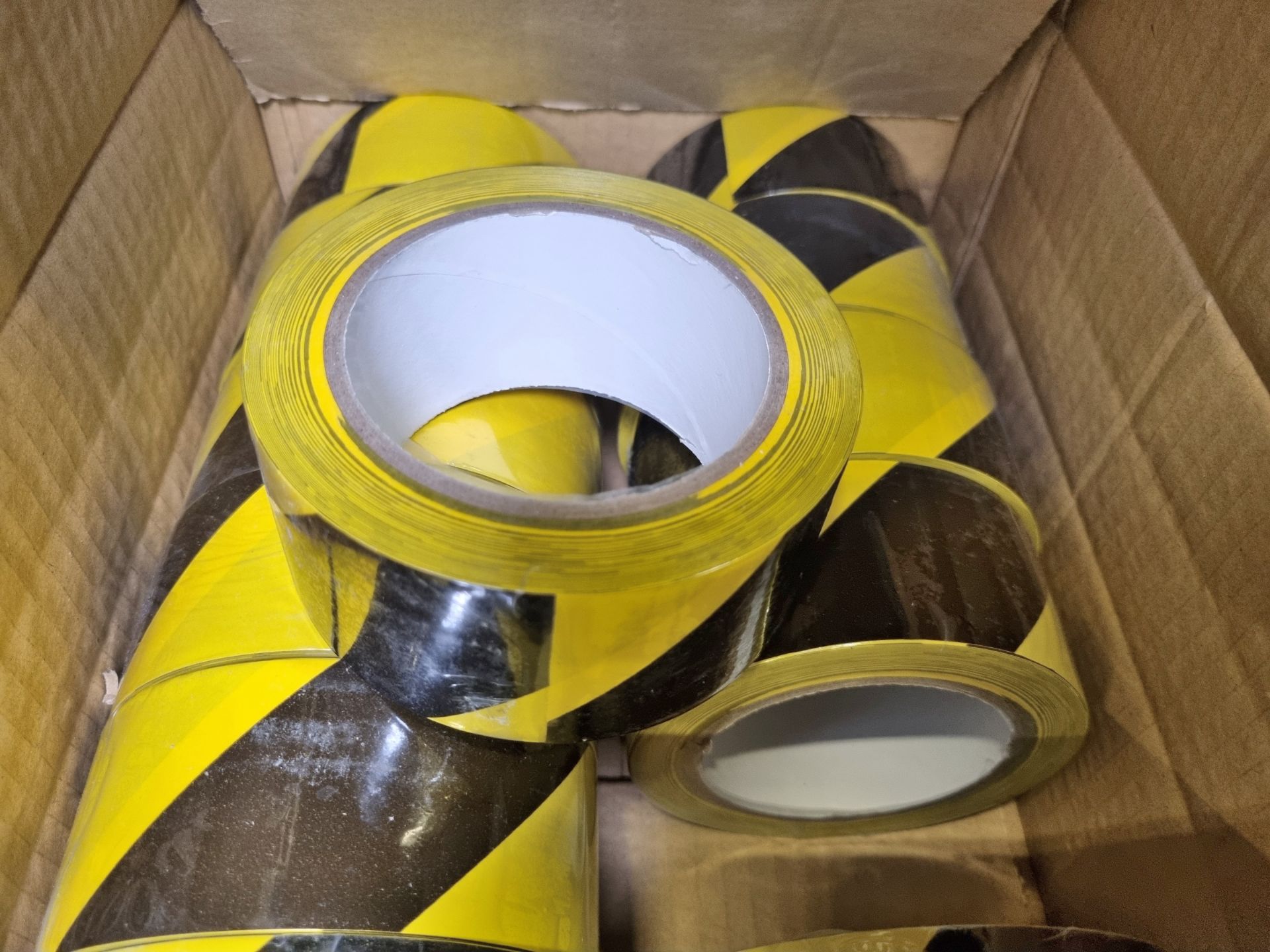 3x boxes of Black and yellow hazard tape - 12 rolls per box - Image 4 of 4
