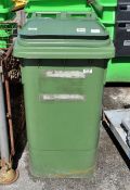 Green plastic wheelie bin - L 840 x W 580 x H 1100mm