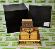 Gold coloured model of Barzan Towers (the West Tower) in Qatar with a Barzan Holdings plaque