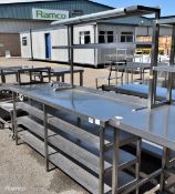 Stainless steel wall table with 3 under shelves and upper twin gantry shelf