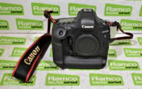 Canon EOS-1DX DSLR camera with battery and strap