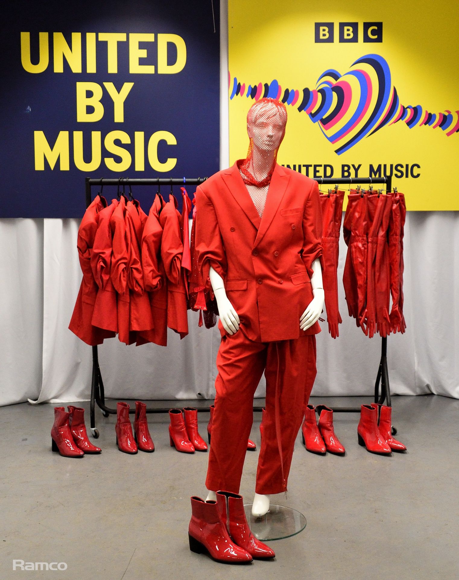 Red Outfits worn by backing dancers during the performance by Tina Karol of 'Show Me Your Love'