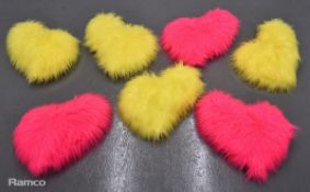 3x pink & 4x yellow heart shaped cushions used on presenters' sofas