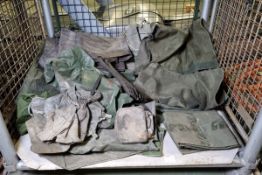 Assorted army bags, canvas coverings and tool rolls