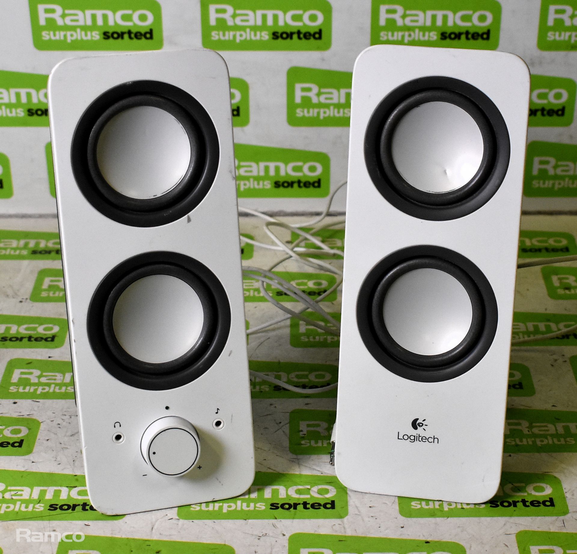 Pair of white Logitech speakers