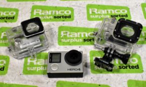 GoPro Hero 4 action camera with case accessories - missing battery and small crack