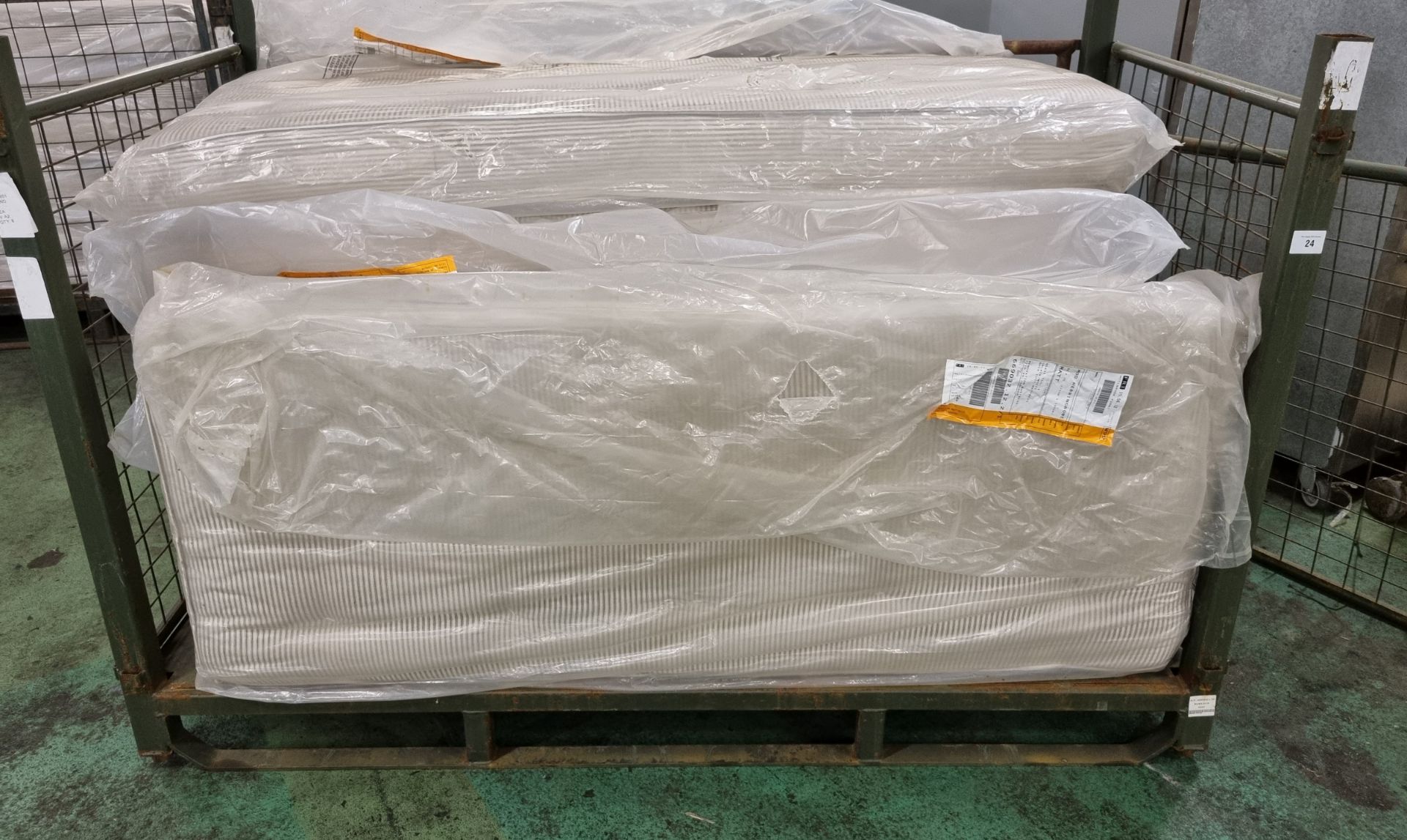 7x Black & white open coil single mattresses - discoloured due to being in storage