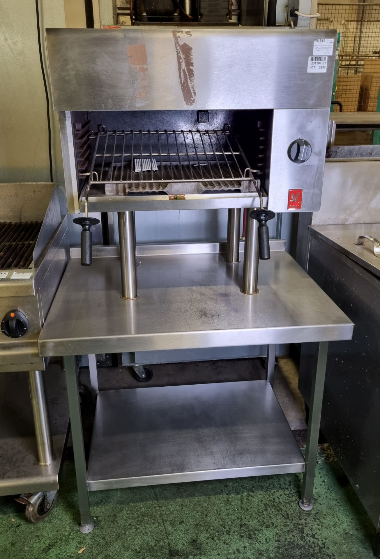 Falcon G3512 stainless steel gas chargrill on stainless steel table with upstand and bottom shelf