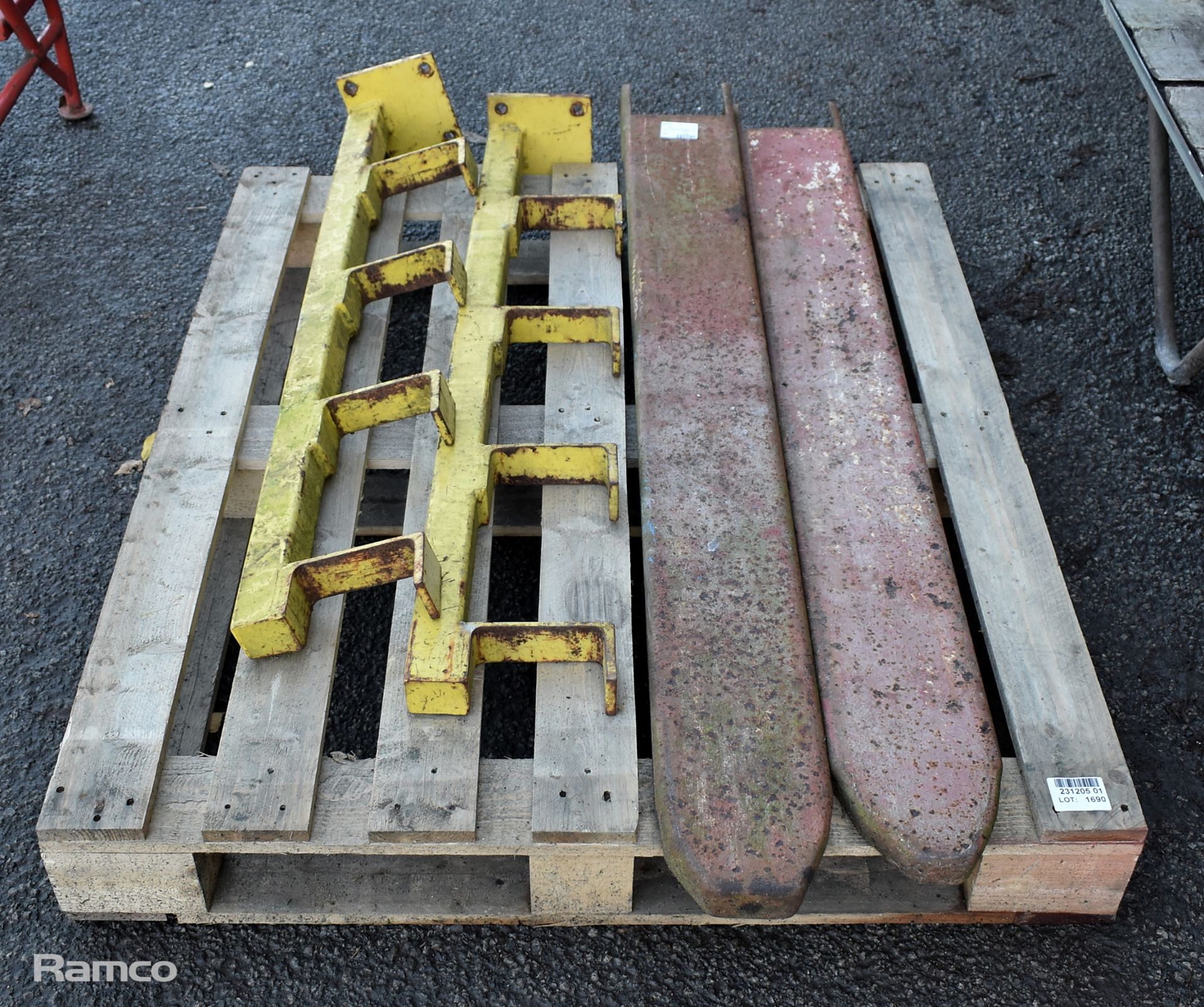 Pair of forklift tine covers and pair of metal rack ends