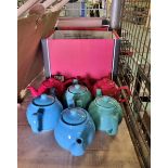 6x Coloured teapots with white cups and saucers