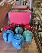 6x Coloured teapots with white cups and saucers