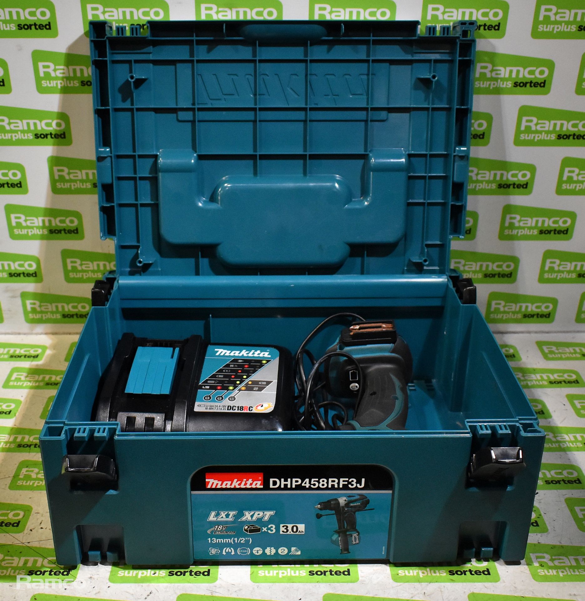 Makita DHP458 cordless drill with DC18RC battery charger, drill handle and storage case