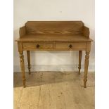 A Victorian pine wash stand, the raised back over two frieze drawers, raised on turned supports,