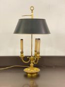 A quality Georgian style cast brass bouillette table light, the adjustable conical tin shade over