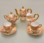 A French Limoges Edwardian morning tea service including teapot, two cups, two saucers, milk jug and