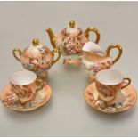 A French Limoges Edwardian morning tea service including teapot, two cups, two saucers, milk jug and