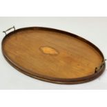 An Edwardian mahogany oval twin brass handled gallery tea tray with shell inlaid centre oval