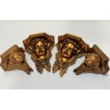 A pair of compressed paper moulded winged cherub wall brackets, (26 x 21 x 10) and a pair of small