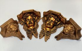 A pair of compressed paper moulded winged cherub wall brackets, (26 x 21 x 10) and a pair of small