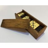A treen box containing a set of dominoes