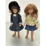 A limited edition Sasha doll 1981 number 3982 with natural brown hair dressed in tartan dress with