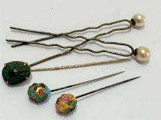 An Edwardian copper enamelled scarab mounted stick pin, (1 x 1), a jeweled enamelled pin, two