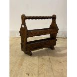 A late 20th century Spanish pitch pine magazine rack, H45cm, W49cm