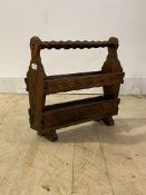 A late 20th century Spanish pitch pine magazine rack, H45cm, W49cm