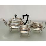 An Epns three piece tea service comprising teapot with scalloped border, matching sugar basin and