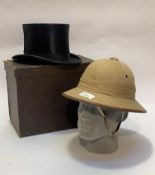 Gentleman's top hat in case by Woodrow Glasgow and a pith helmet of Spanish manufacture