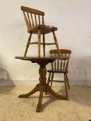 A polished pine circular topped pedestal table (H73cm, D91cm) together with a pair of matching