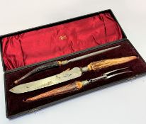 An Edwardian Slater Bros of Sheffield three piece horn handled carving set complete with original