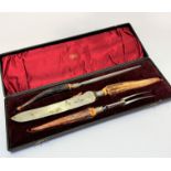 An Edwardian Slater Bros of Sheffield three piece horn handled carving set complete with original