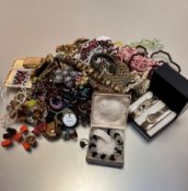 A large collection of costume jewellery including a lady's watch and bracelet complete with box, a