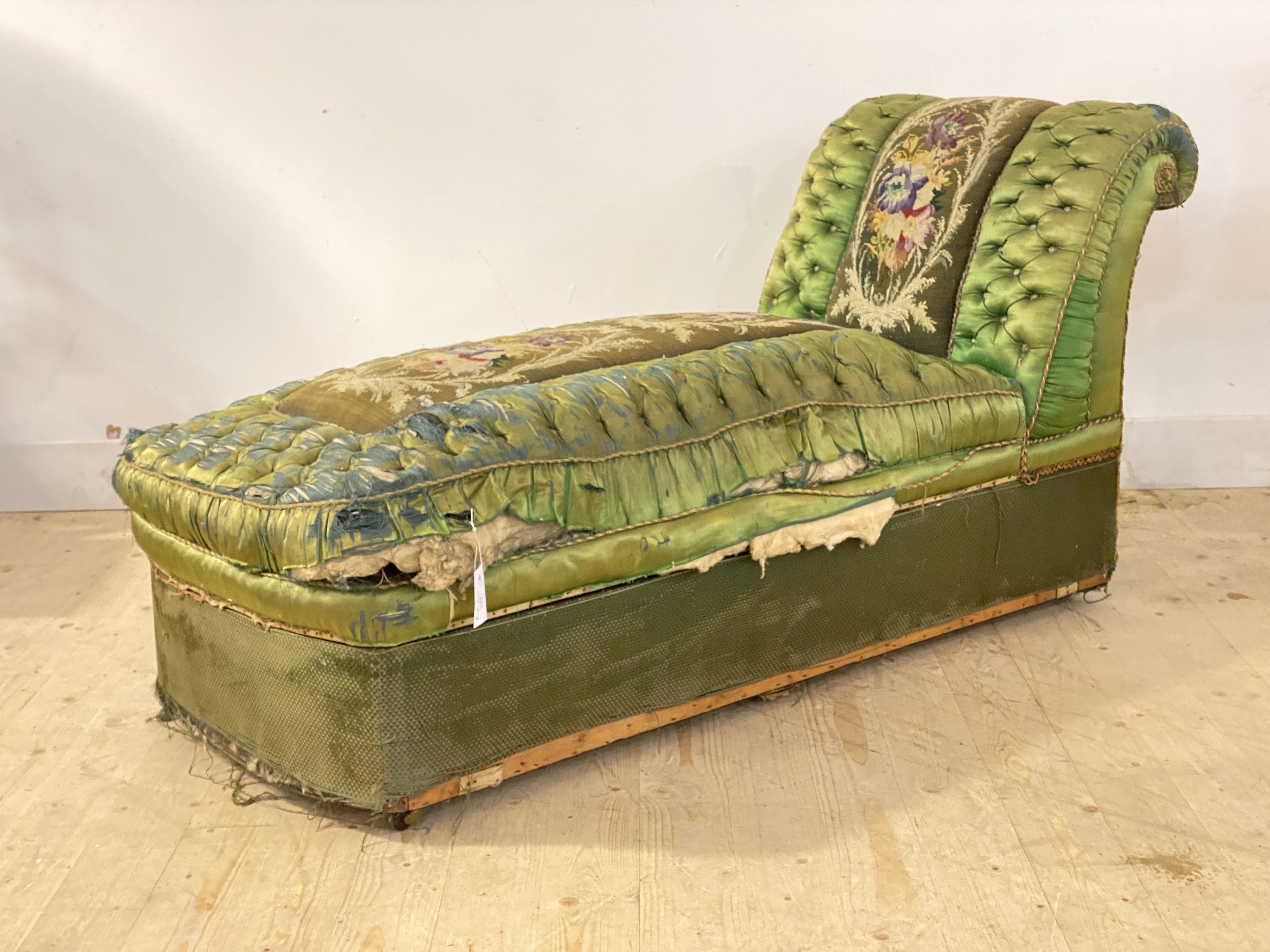 A Victorian upholstered chaise ottoman, pine framed and moving on castors, (Upholstery A/F) H80cm,