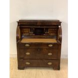 A Continental 19th century mahogany cylinder writing bureau, the caddy top over fitted interior,