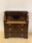 A Continental 19th century mahogany cylinder writing bureau, the caddy top over fitted interior,