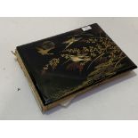 An early 20thc Japanese lacquered photograph album decorated with cranes and bamboo, containing