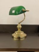 A gilt brass bankers style light with green glass shade H37cm