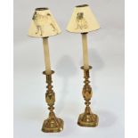 A pair of Victorian cast brass Queen of Diamonds candlesticks raised on baluster knop turned stems