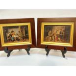 A pair of photographs mounted on panel with overpainted domestic scenes with hunter with fox cubs