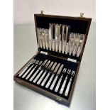 A set of twelve pairs of Epns mother of pearl handled fruit knives and forks in original oak