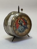 A German Nurnburg souvenir alarm clock, circular steel case with paper face depicting Adolf