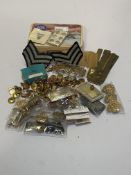 RAF interest. A tin containing cap badges, buttons, odd sweetheart brooches etc.