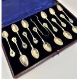 A set of twelve Birmingham silver foliate and spiral twist stemmed tea spoons complete with original
