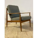 Grete Jalk for France & Son, A Danish teak framed lounge chair, with swept open arms enclosing
