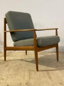 Grete Jalk for France & Son, A Danish teak framed lounge chair, with swept open arms enclosing