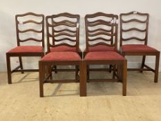 A set of six 20th century Georgian style mahogany ladder back dining chairs, with drop in seat pads,